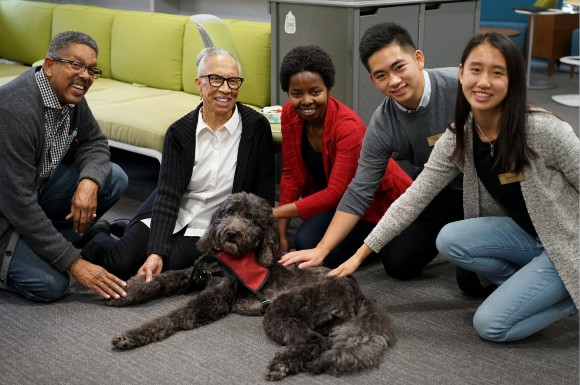 Gerontology professors and students with Beau, the USC therapy dog.